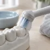 Oral debriding with electric toothbrushes: how deep cleaning reshapes daily care